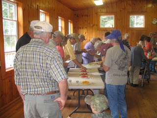 attendees participating in the tomato taste test