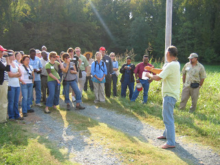 Ray Christopher describing his farm to a group extension agents Read more at: https://newcropsorganics.ces.ncsu.edu/2009/09/advanced-organic-horticulture-training-for-extension-agents-was-a-success/?showQA