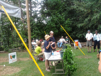 Rita Pelczar and John Wright describing their certified organic hop yard in Madison County.