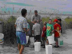 children working with dune plants