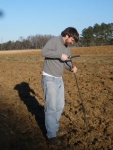 man taking soil samples