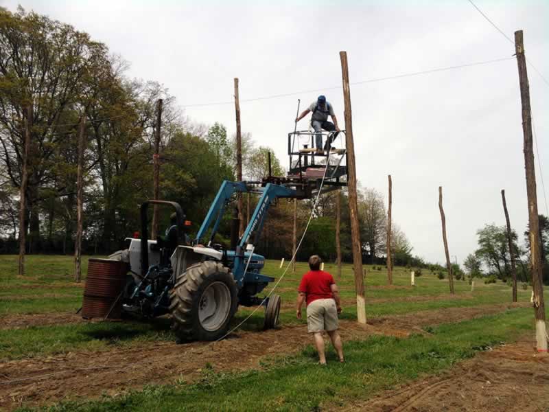 attaching cables to the poles